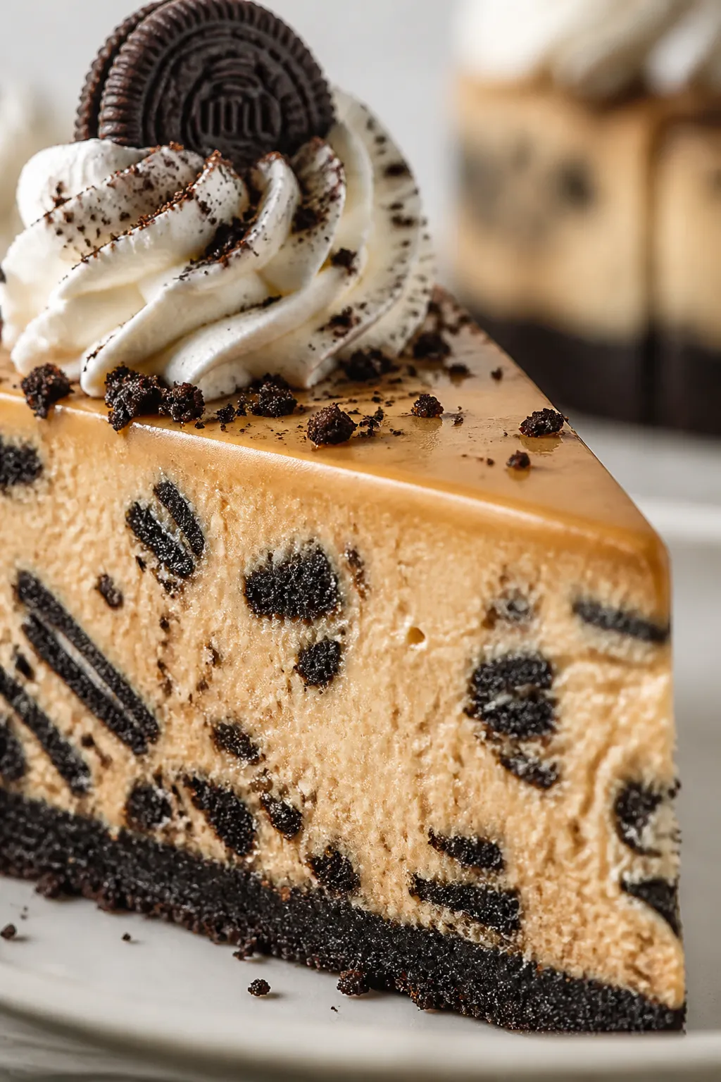 Close-up detail shot of a sliced Pumpkin Oreo Cheesecake showing the ultra-creamy, velvety pumpkin f