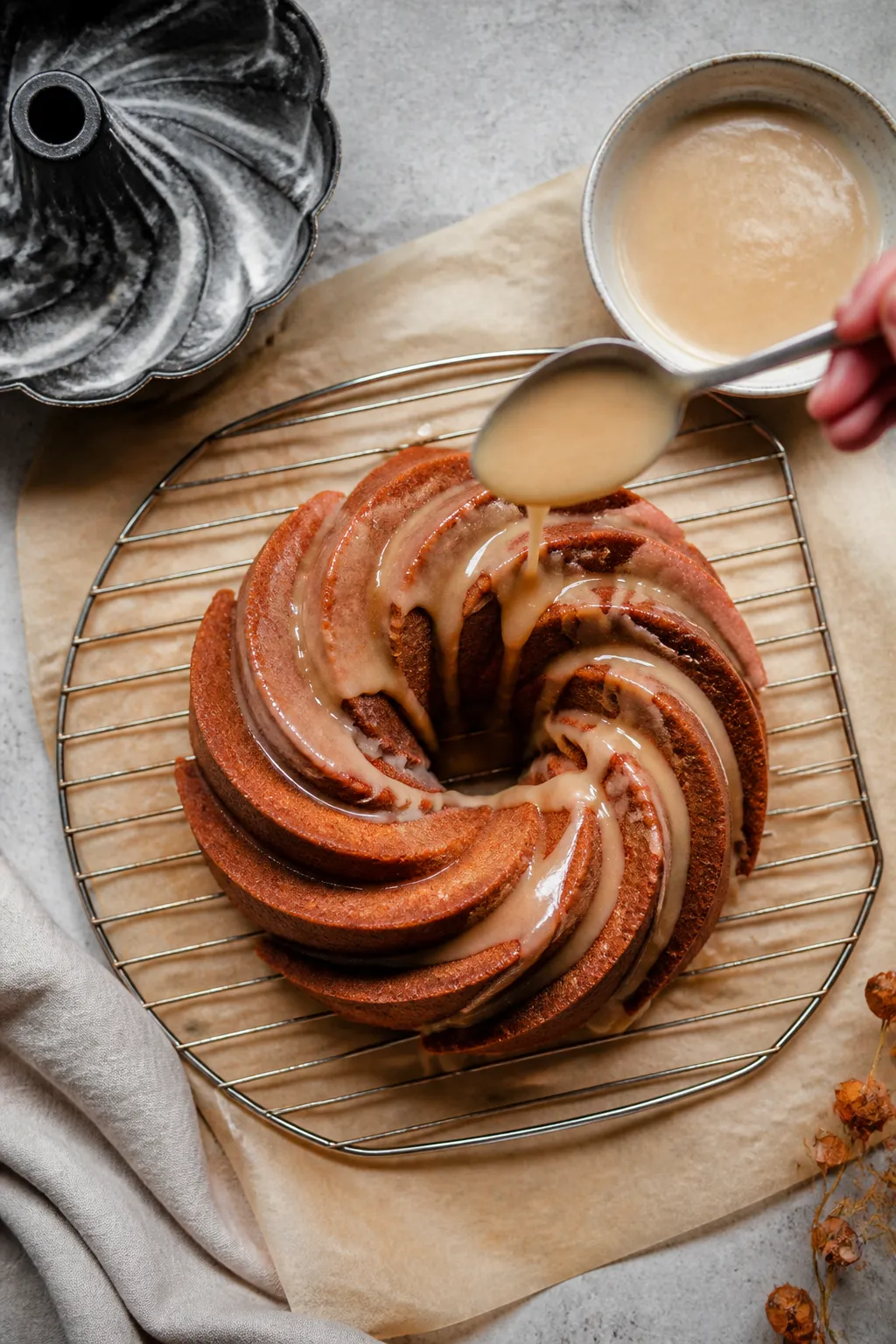Cooking process: Overhead shot of the baked Bundt just released onto a wire rack, fully intact with 
