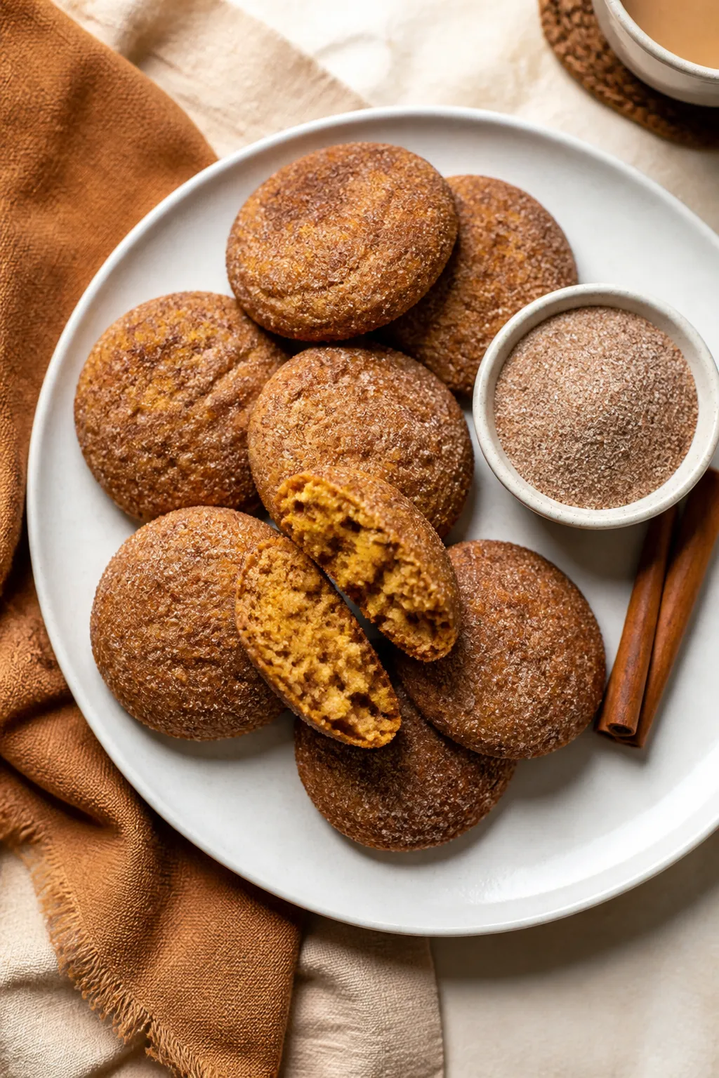 Final dish presentation: Beautifully plated stack of pumpkin snickerdoodle cookies on a matte white 