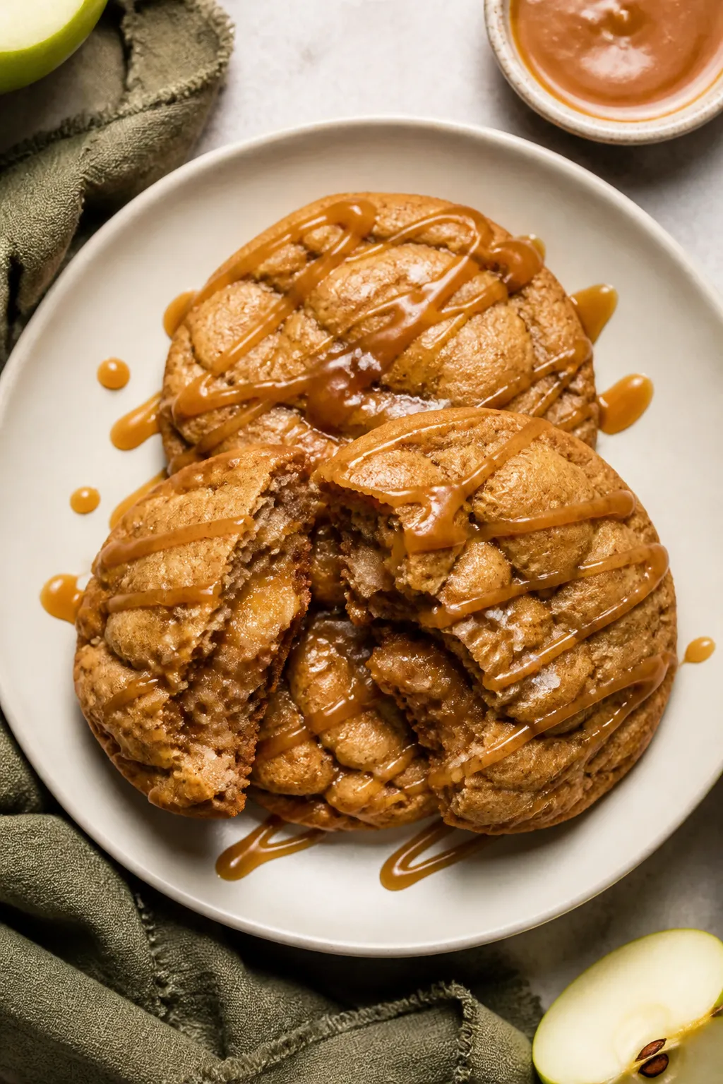 Final dish presentation: Restaurant-quality plate of three Apple Pie Stuffed Cookies stacked and sta