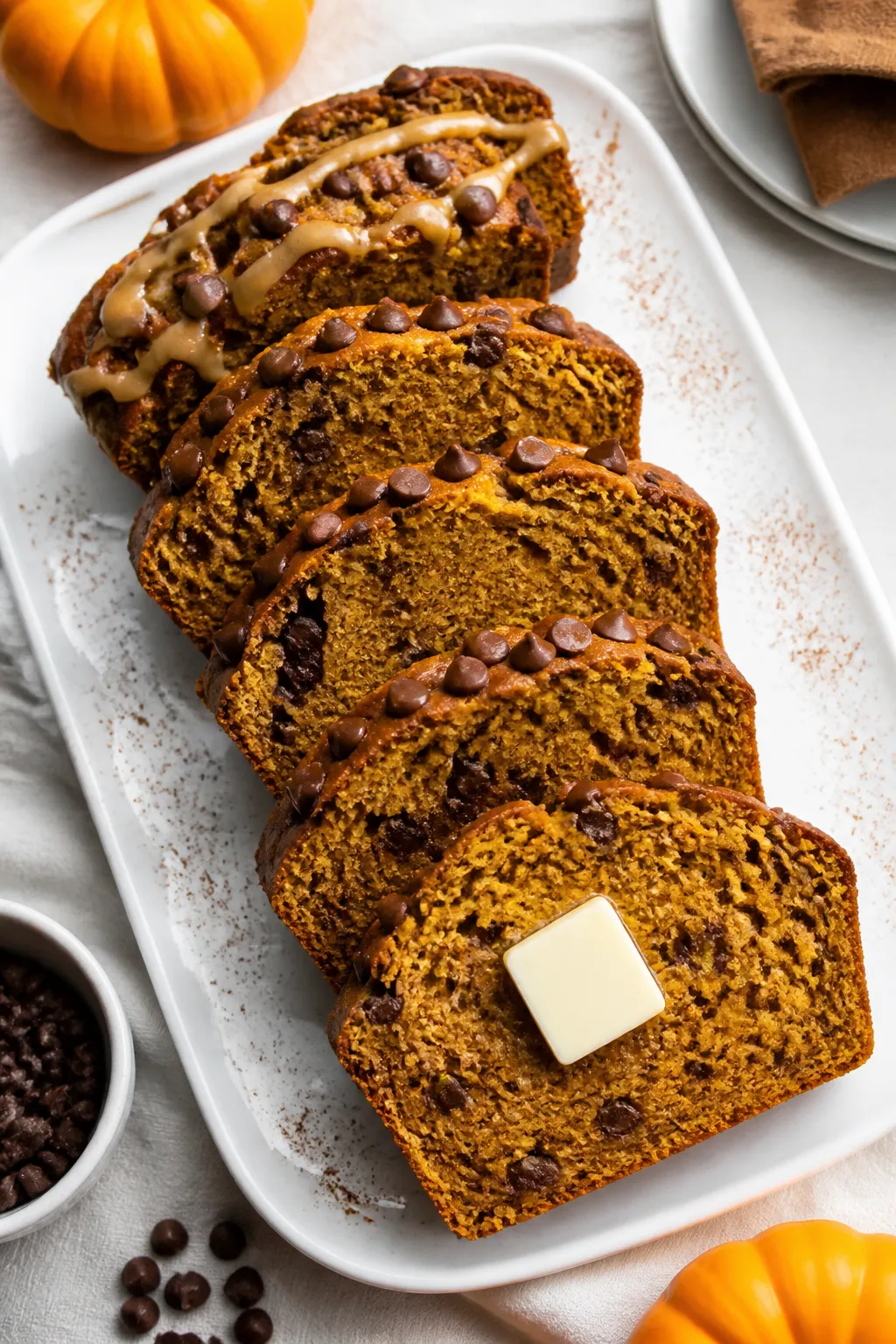 Final presentation: Beautifully plated slices of pumpkin chocolate chip bread arranged fanned-out on
