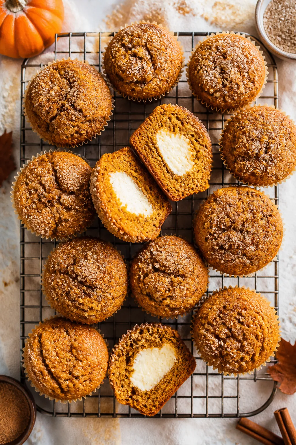 Overhead “tasty top view”: A cooling rack filled with freshly baked pumpkin cream cheese muffins