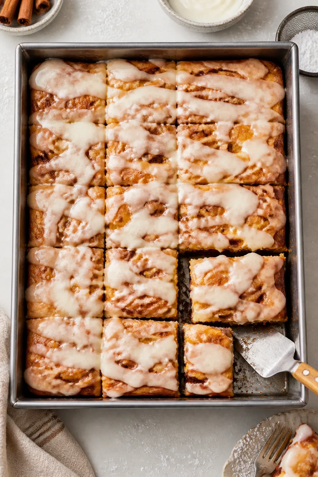 Tasty top view for serving: Overhead shot of the warm cake still in the pan, freshly glazed; glaze d