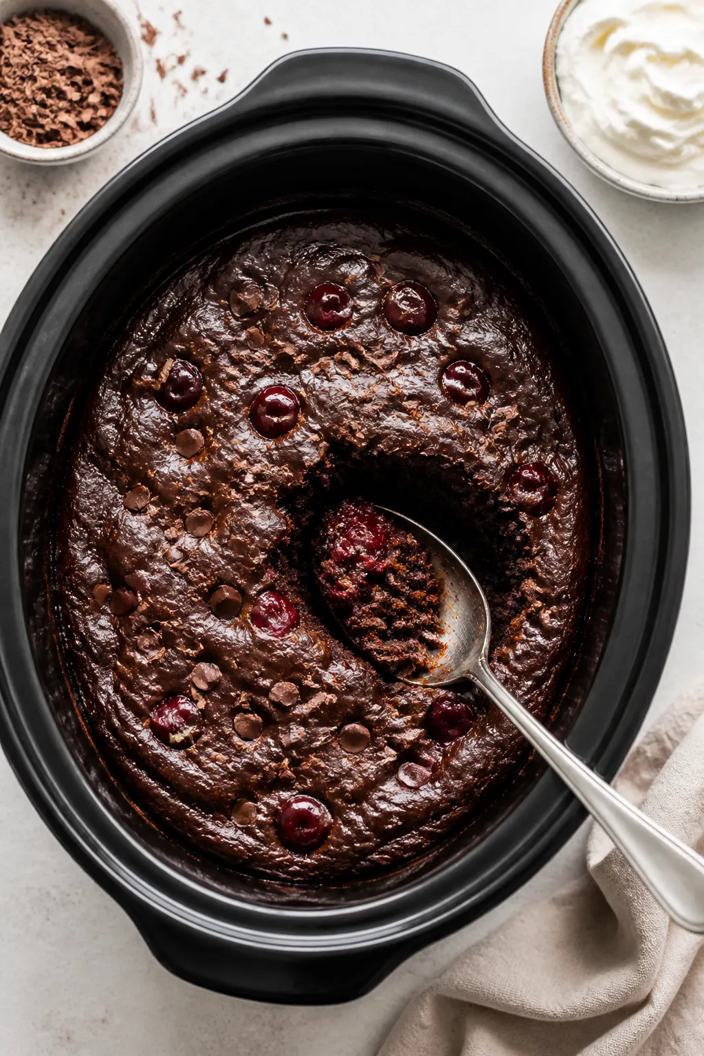 Tasty top view: Overhead shot of the finished cake still in the slow cooker, surface rippled and glo